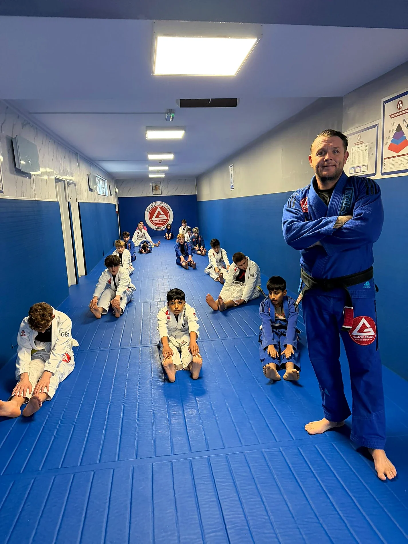 Young Gracie Barra Bath students in a kids Jiu‑Jitsu class