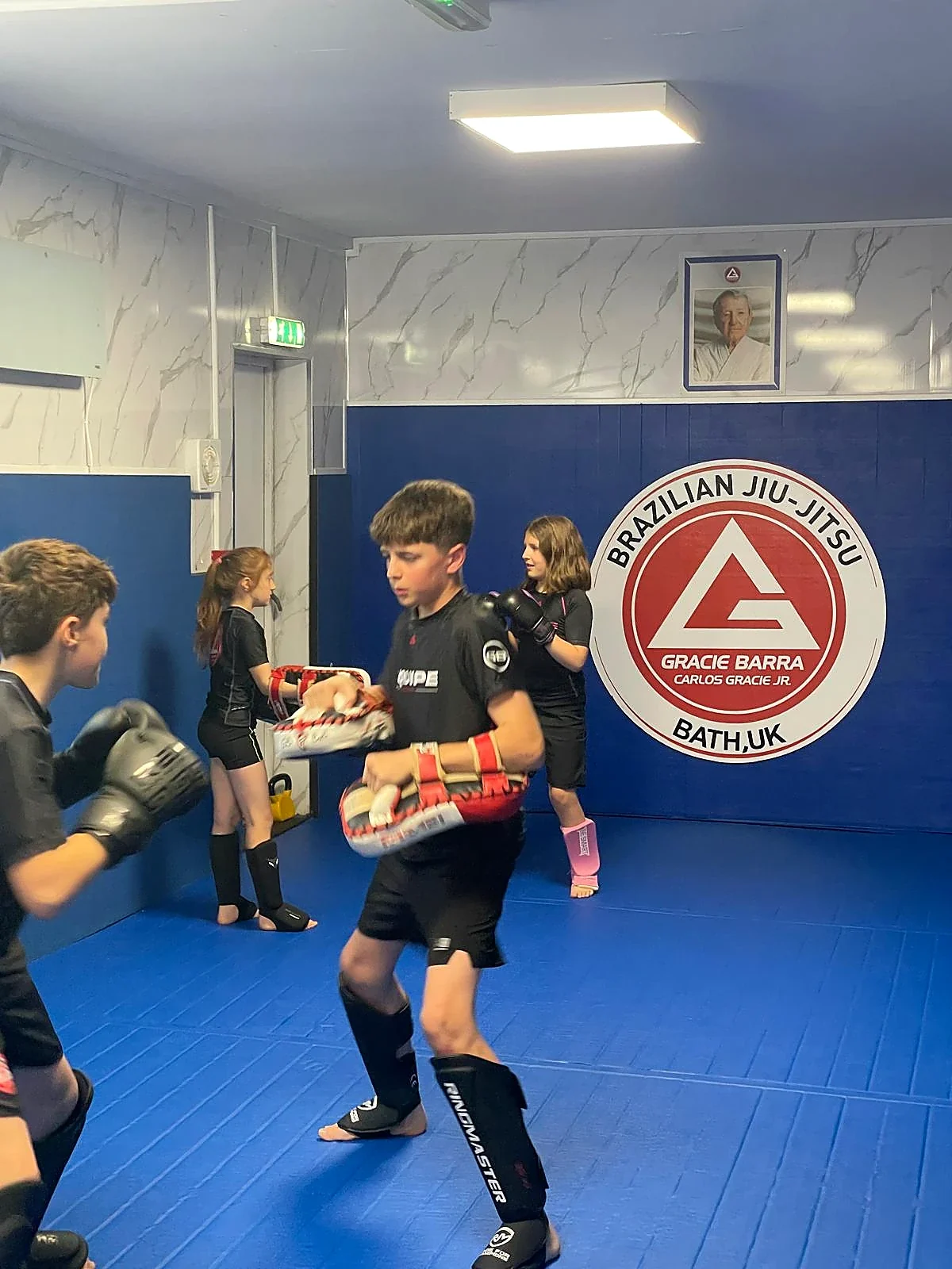 Pad training inside the Gracie Barra Bath academy